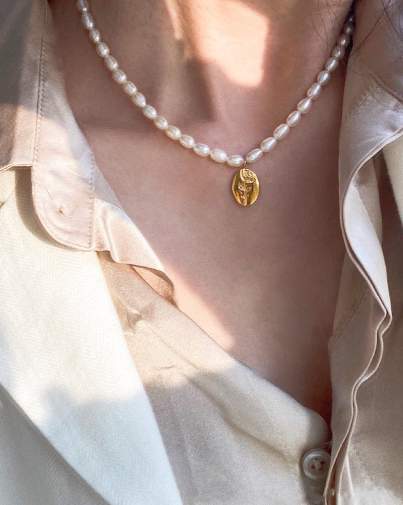 Natural pearls beaded necklace from C&L jewellery, with a rose engraved  pendant
