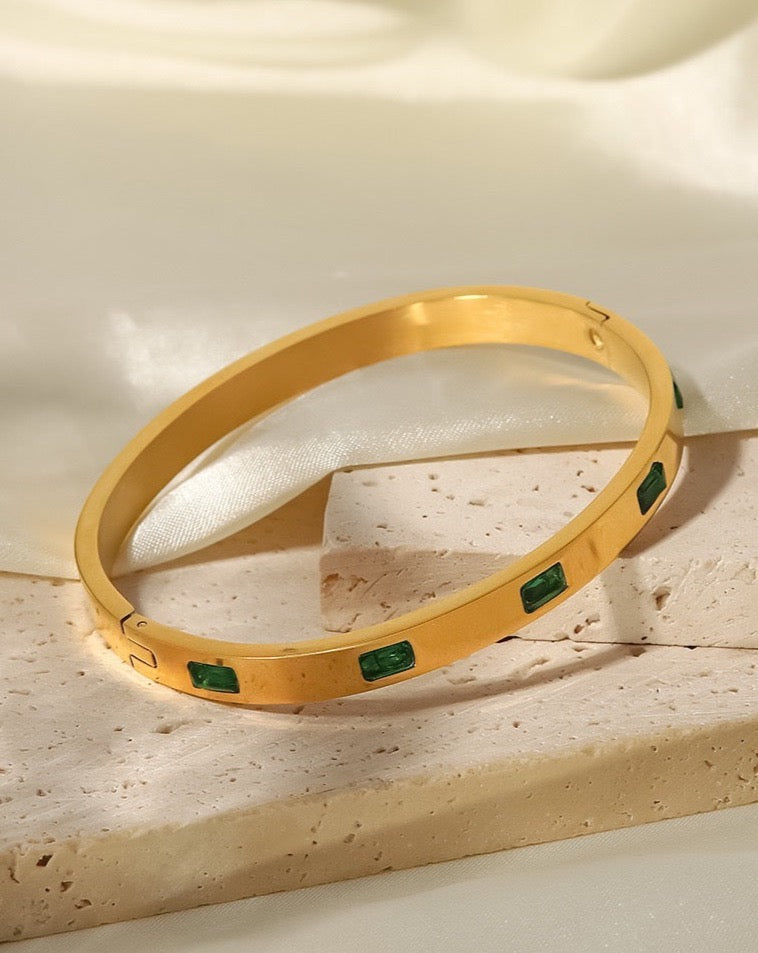 gold bangle C&L Jewellery with green zircons